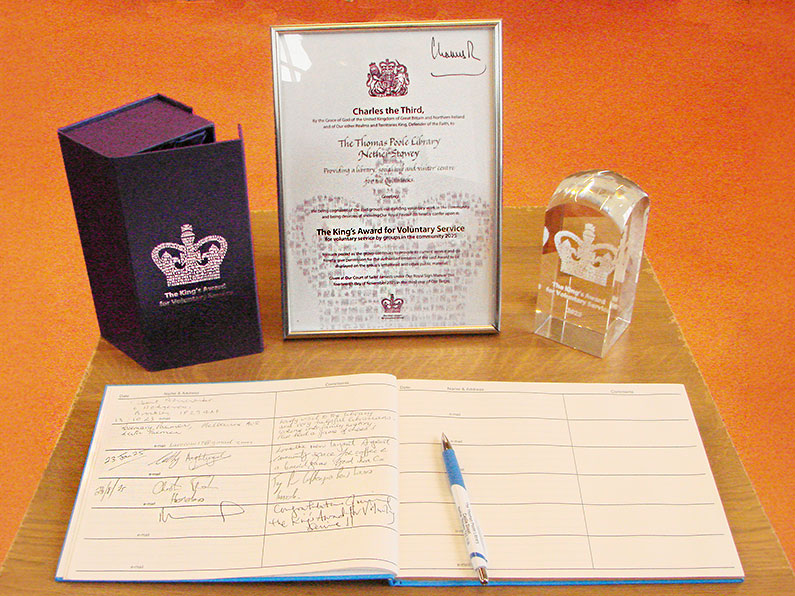 A Royal Recognition for Thomas Poole Library Cutting the Cake Certificate and Trophy